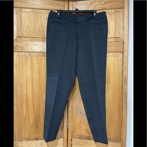 IMAN Women’s snake print dress pants.